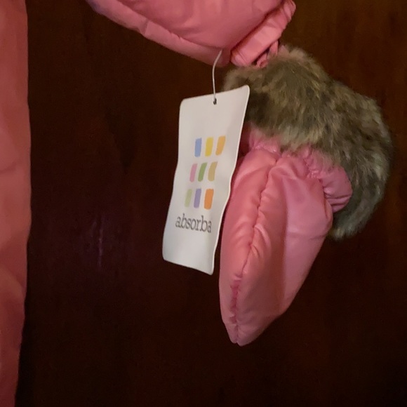 Absorbs slightly hot pink snowsuit. Great a cold weather day. - Picture 2 of 9